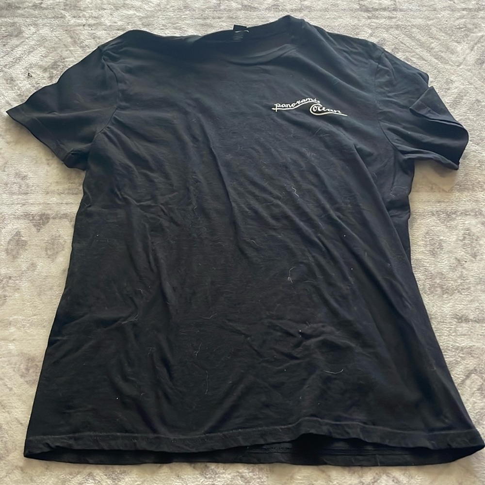 Medium black T shirt with Panoramic ocean logo on front and orca picture on back